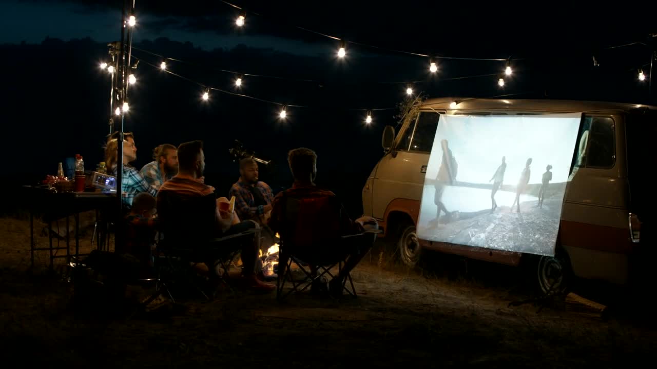 Stock Video Group Of Friends Watching A Movie With A Projector Live Wallpaper For PC