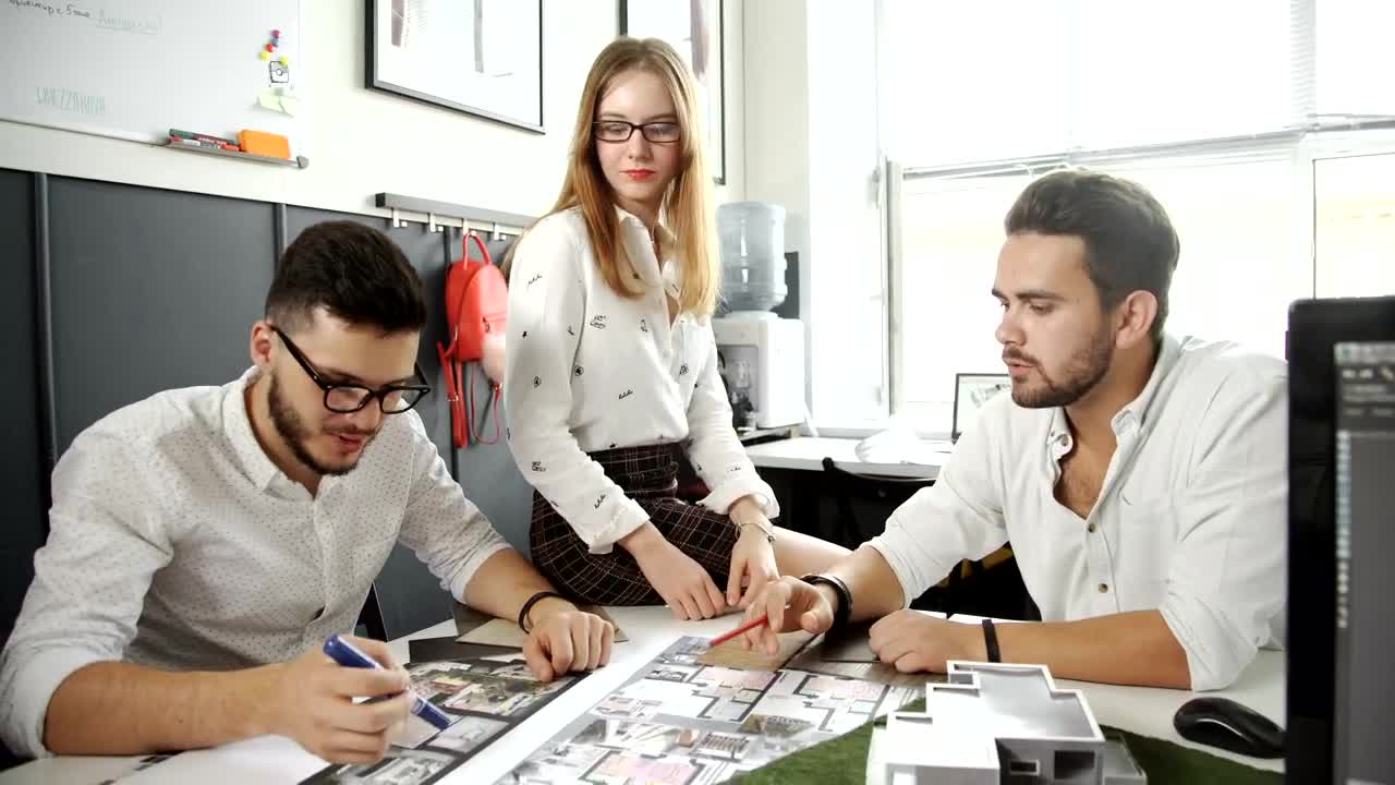 Stock Video Group Of Architects Discussing A Building Model Live Wallpaper For PC
