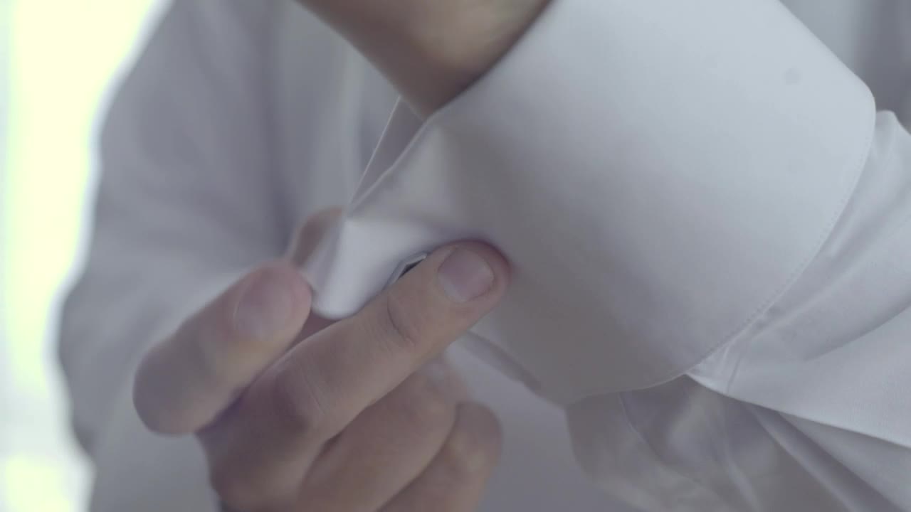 Stock Video Groom Placing Cufflinks On His Sleeves Live Wallpaper For PC
