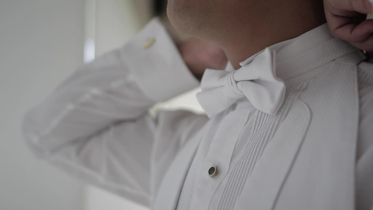 Stock Video Groom Adjusting The Bow Tie Of His Tuxedo Live Wallpaper For PC