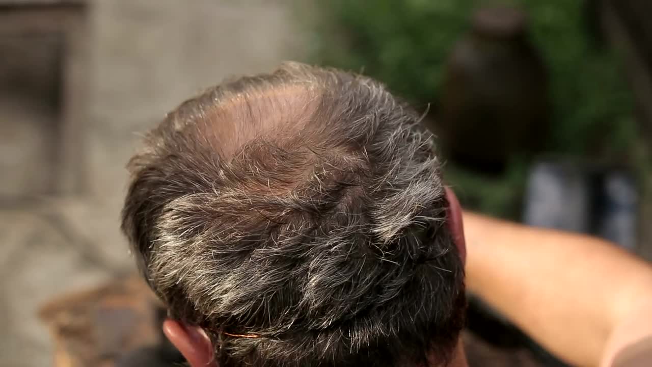 Stock Video Gray Head Of A Man While Working On A Table Live Wallpaper For PC