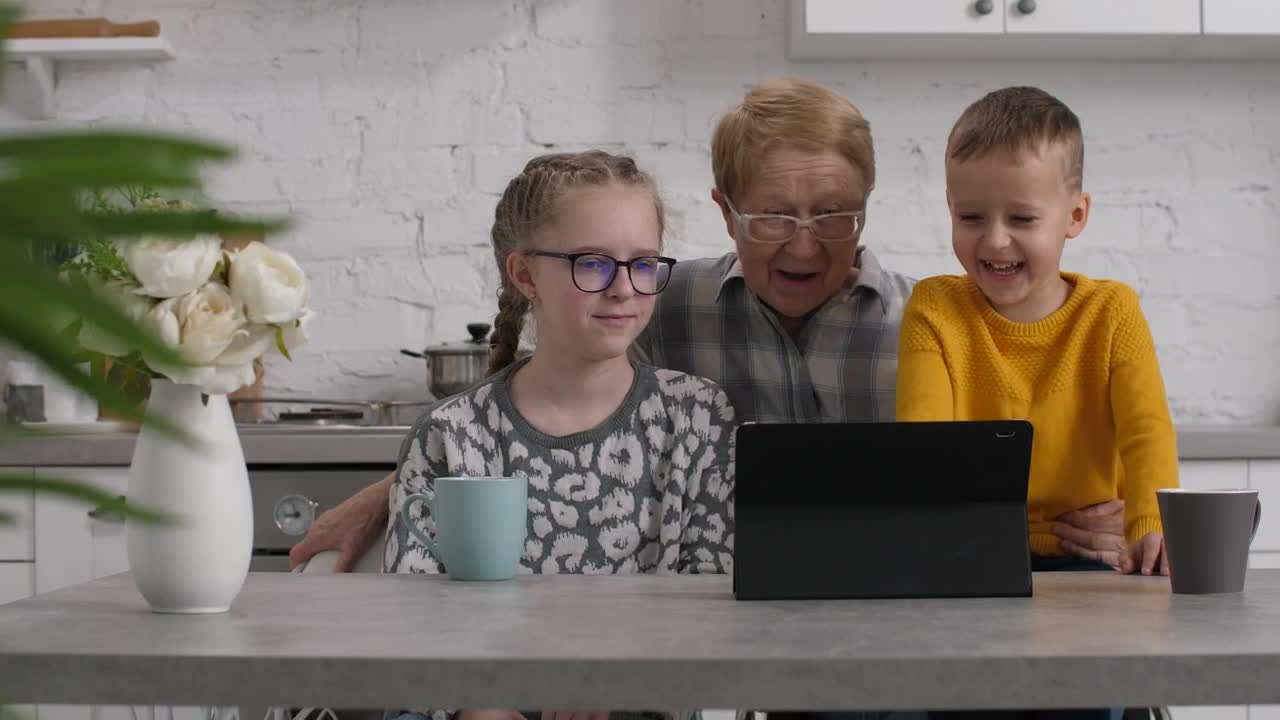 Stock Video Grandmother Enjoying A Video With Her Family Live Wallpaper For PC