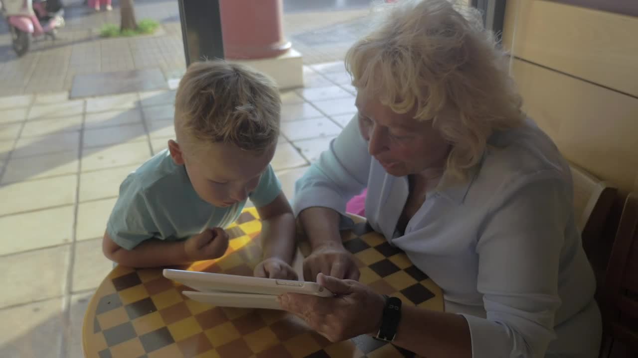 Stock Video Grandmother And Child Using A Tablet Live Wallpaper For PC