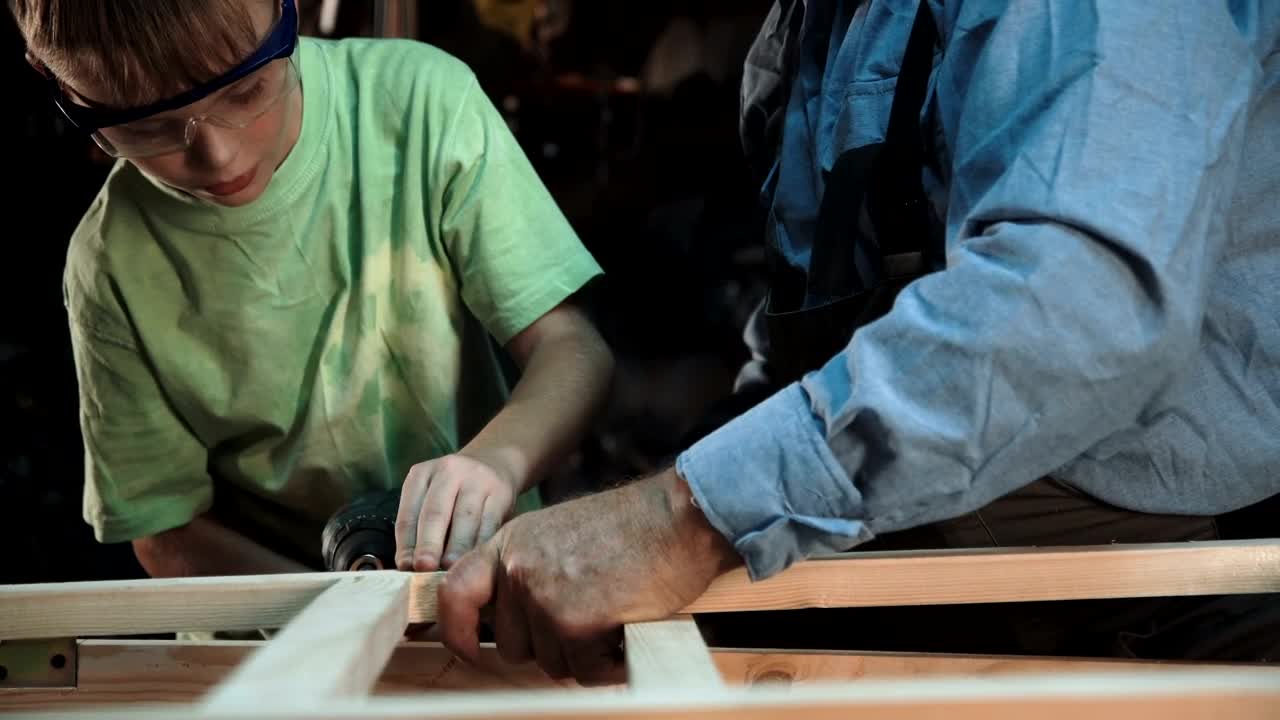 Stock Video Grandfather And Grandson Working On A Project Live Wallpaper For PC