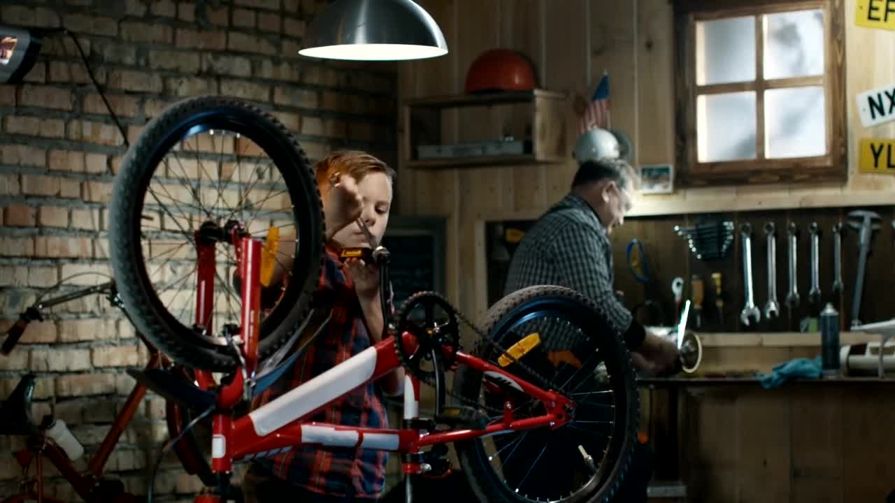 Stock Video Grandfather And Grandson Repairing A Bicycle Live Wallpaper For PC