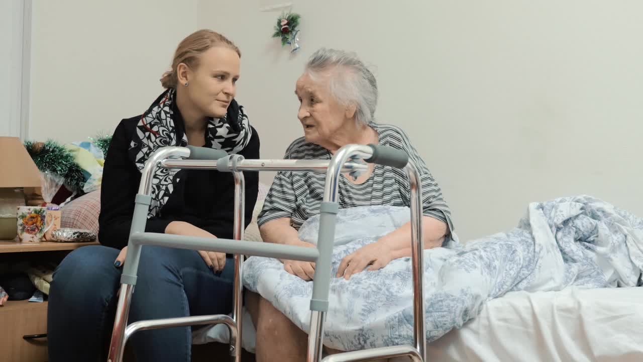 Stock Video Granddaughter Visiting An Elderly Relative Live Wallpaper For PC
