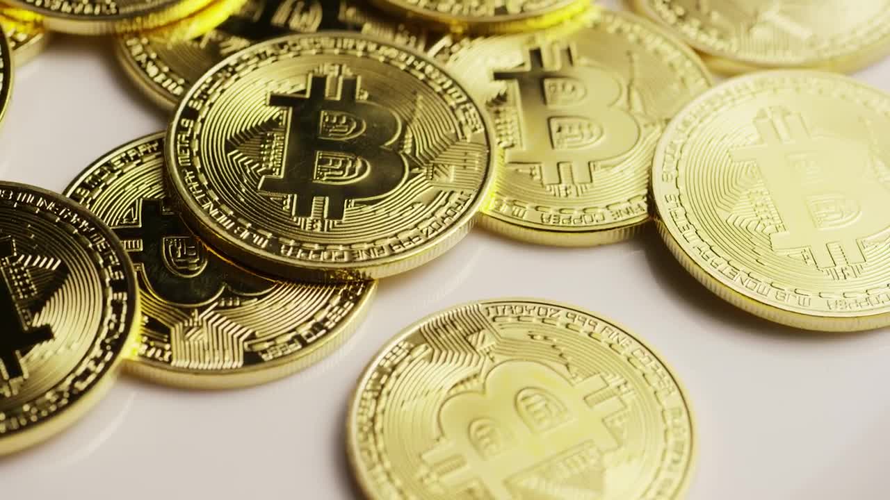 Stock Video Golden Physical Bitcoins Rotating On A Surface Live Wallpaper For PC
