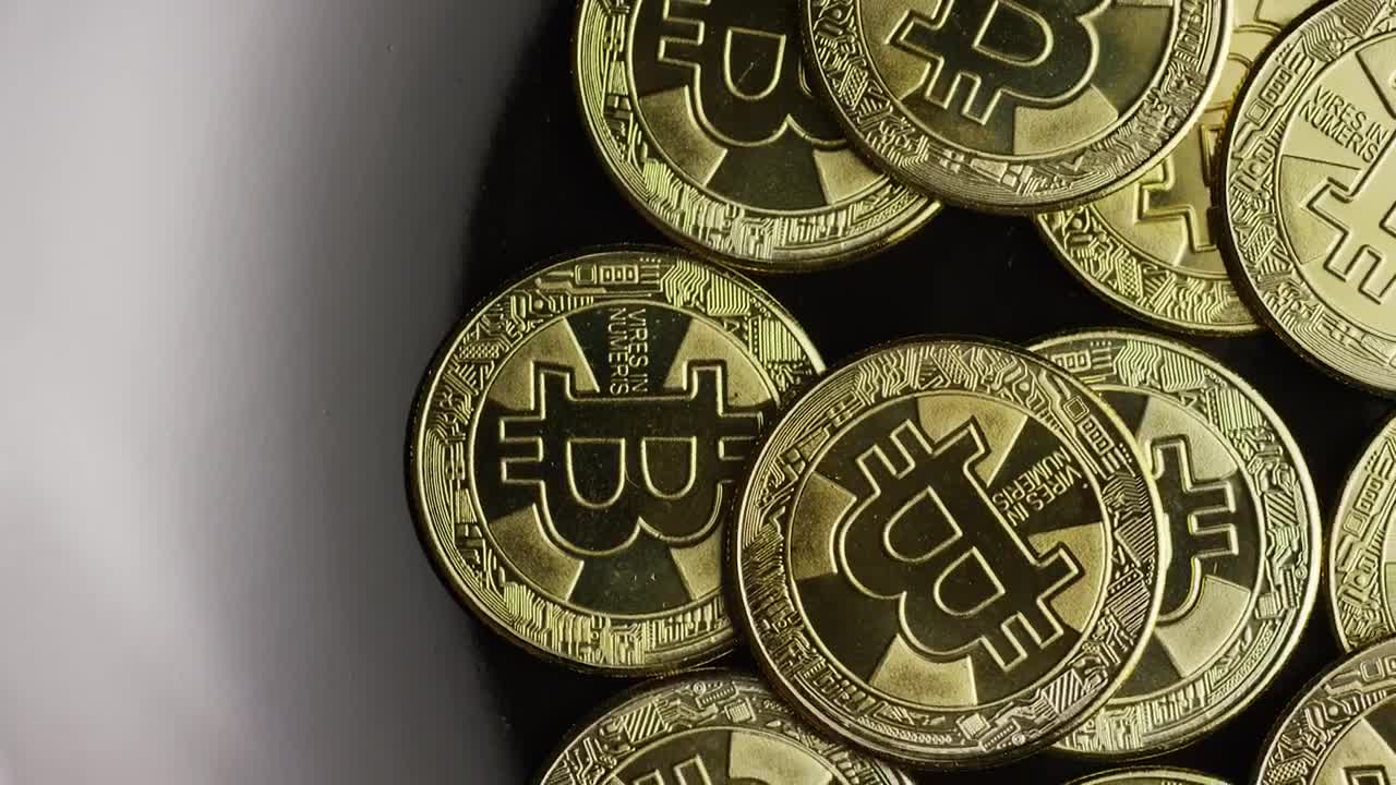 Stock Video Golden Bitcoins Rotating On A Black Plate Live Wallpaper For PC