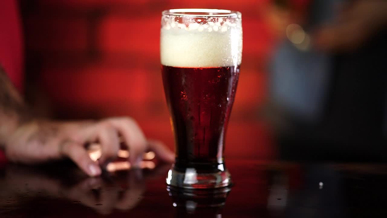 Stock Video Glass Of Beer In The Center Of A Table At Live Wallpaper For PC