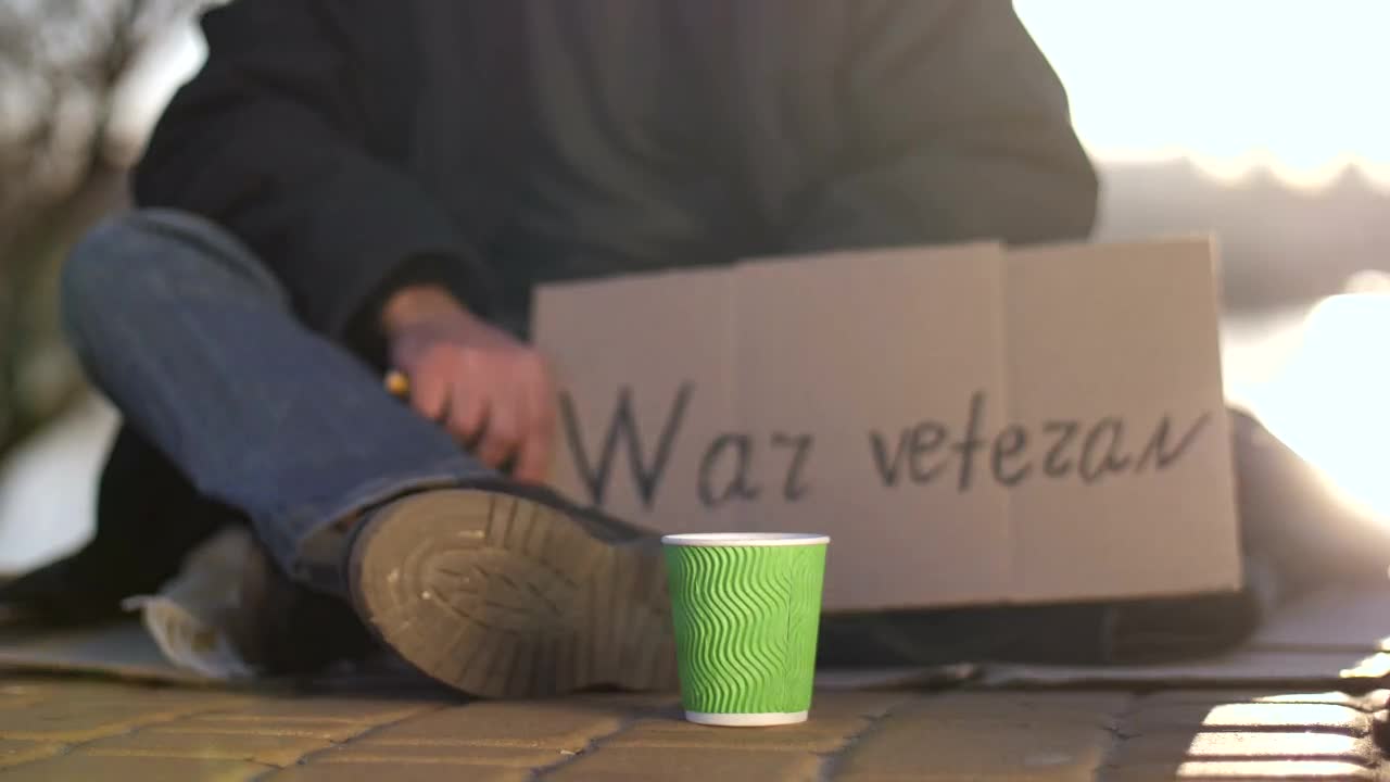 Stock Video Giving Money To A Homeless Man Live Wallpaper For PC
