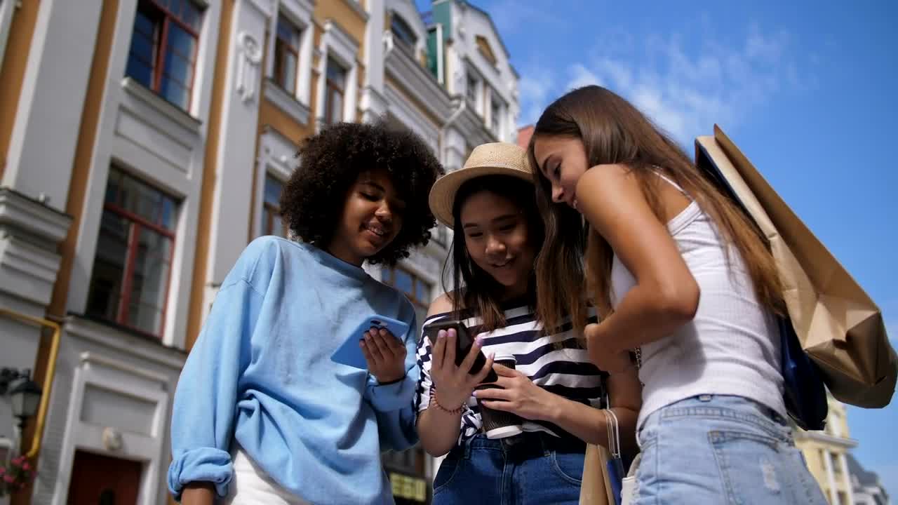 Stock Video Girls Checking Text Messages While Out For The Day Live Wallpaper For PC