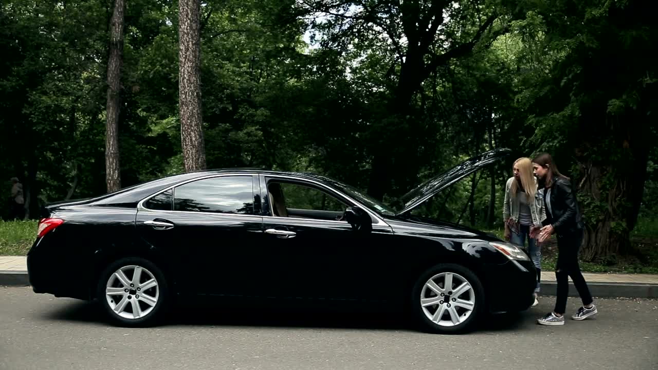 Stock Video Girls Argue Over Hood Of Broken Down Automobile Live Wallpaper For PC