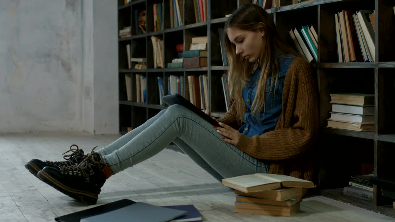 Stock Video Girl Working On The Floor Of A Library Live Wallpaper For PC