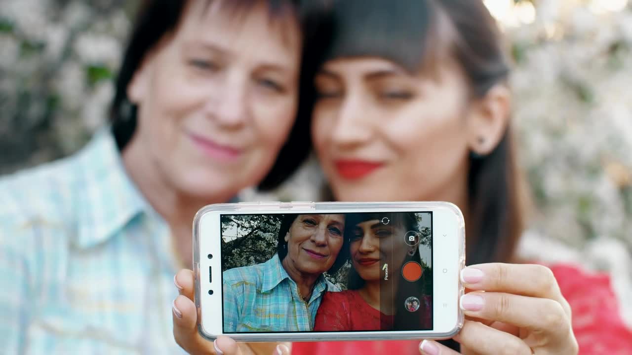 Stock Video Girl With Her Mother Taking A Selfie Together Live Wallpaper For PC