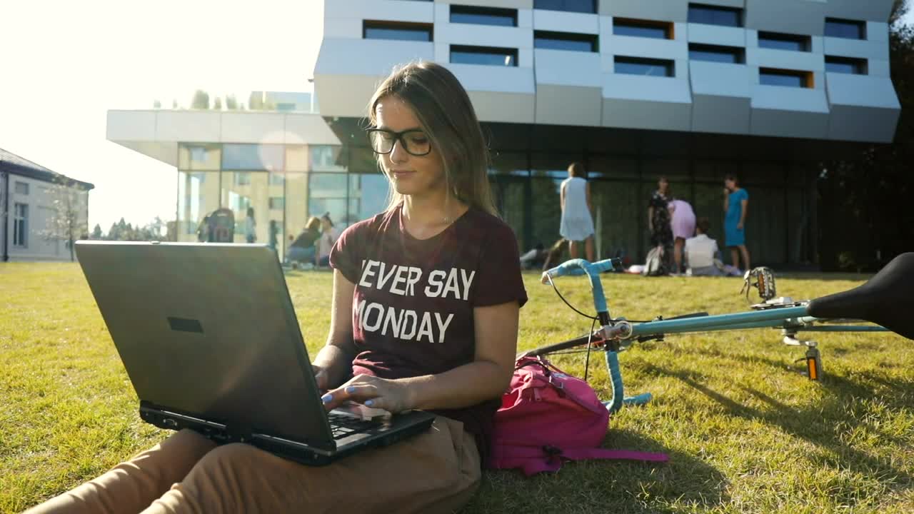 Stock Video Girl Types On Laptop Outside University Building Live Wallpaper For PC