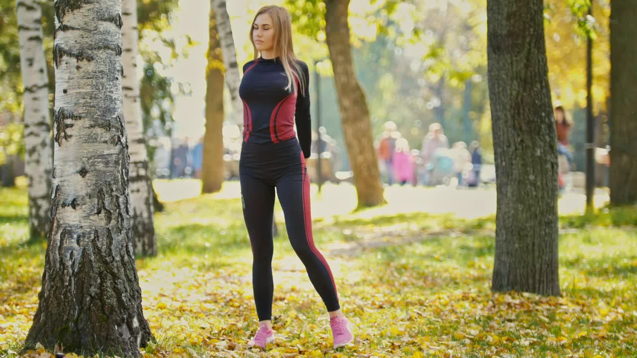 Stock Video Girl Stretching And Warming Up In A Sunny Park Live Wallpaper For PC