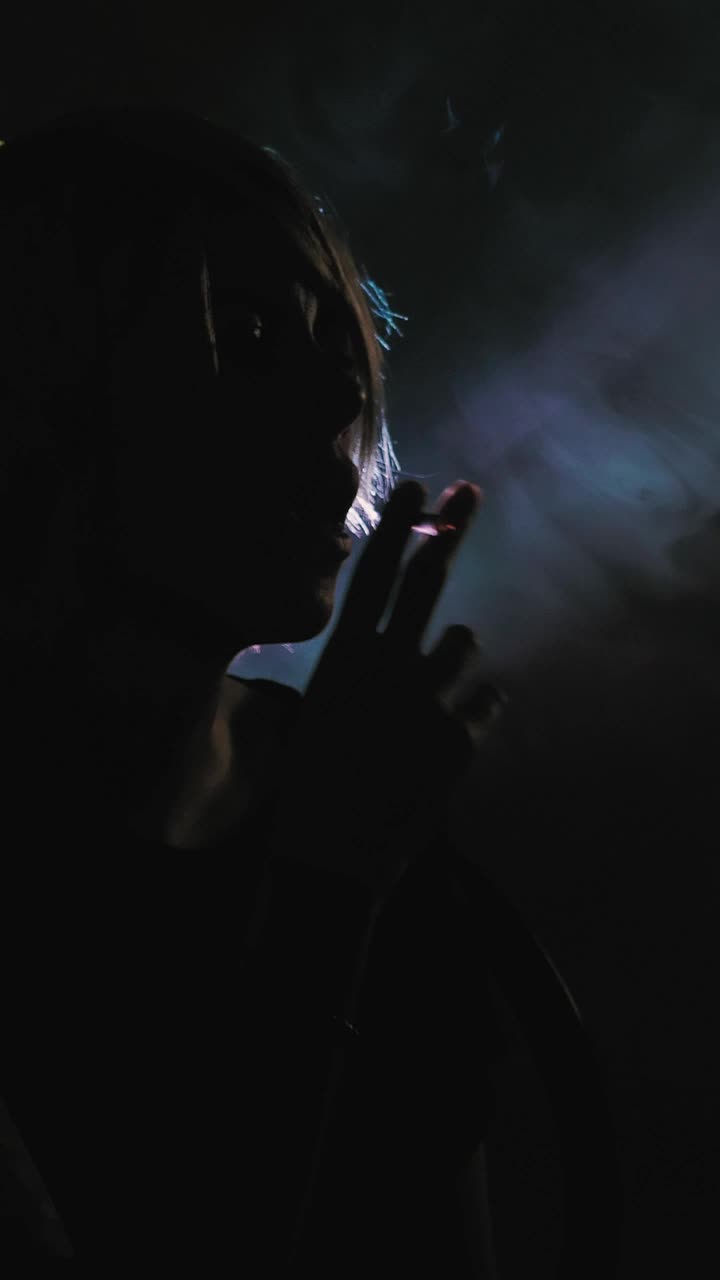 Stock Video Girl Smoking In The Shadows With A Backlight Live Wallpaper For PC