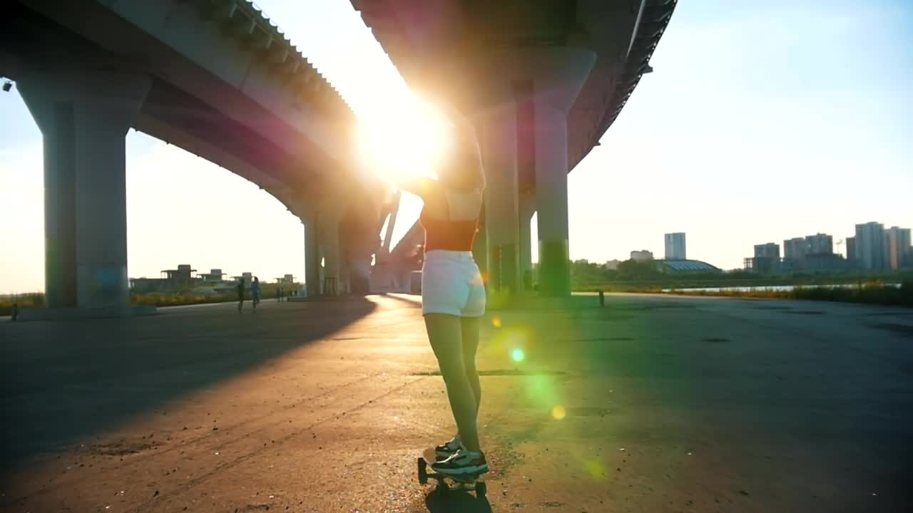 Stock Video Girl Skating In The Afternoon Under A Bridge Live Wallpaper For PC