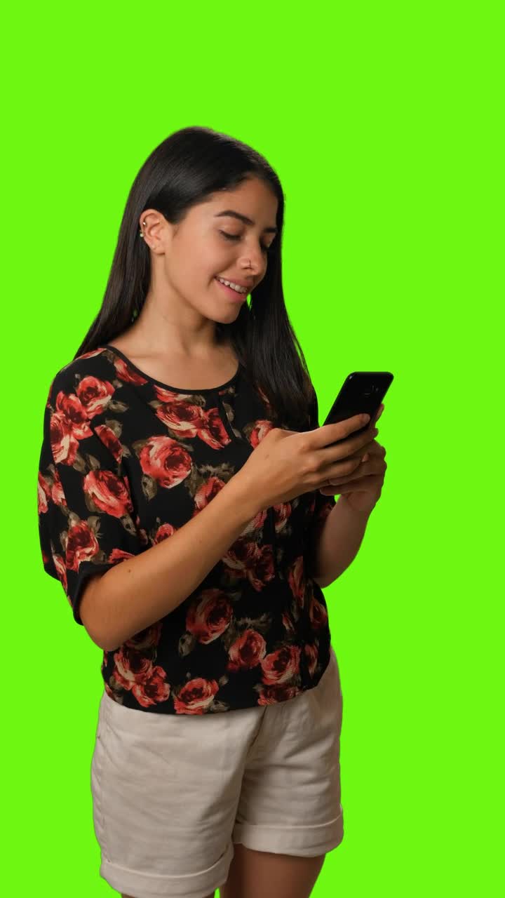 Stock Video Girl Sending A Selfie By Cell Phone On A Green Live Wallpaper For PC