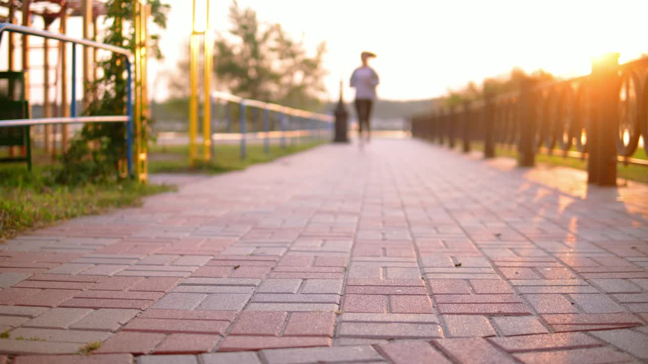 Stock Video Girl Running During Sunset Ties Her Shoelaces Live Wallpaper For PC