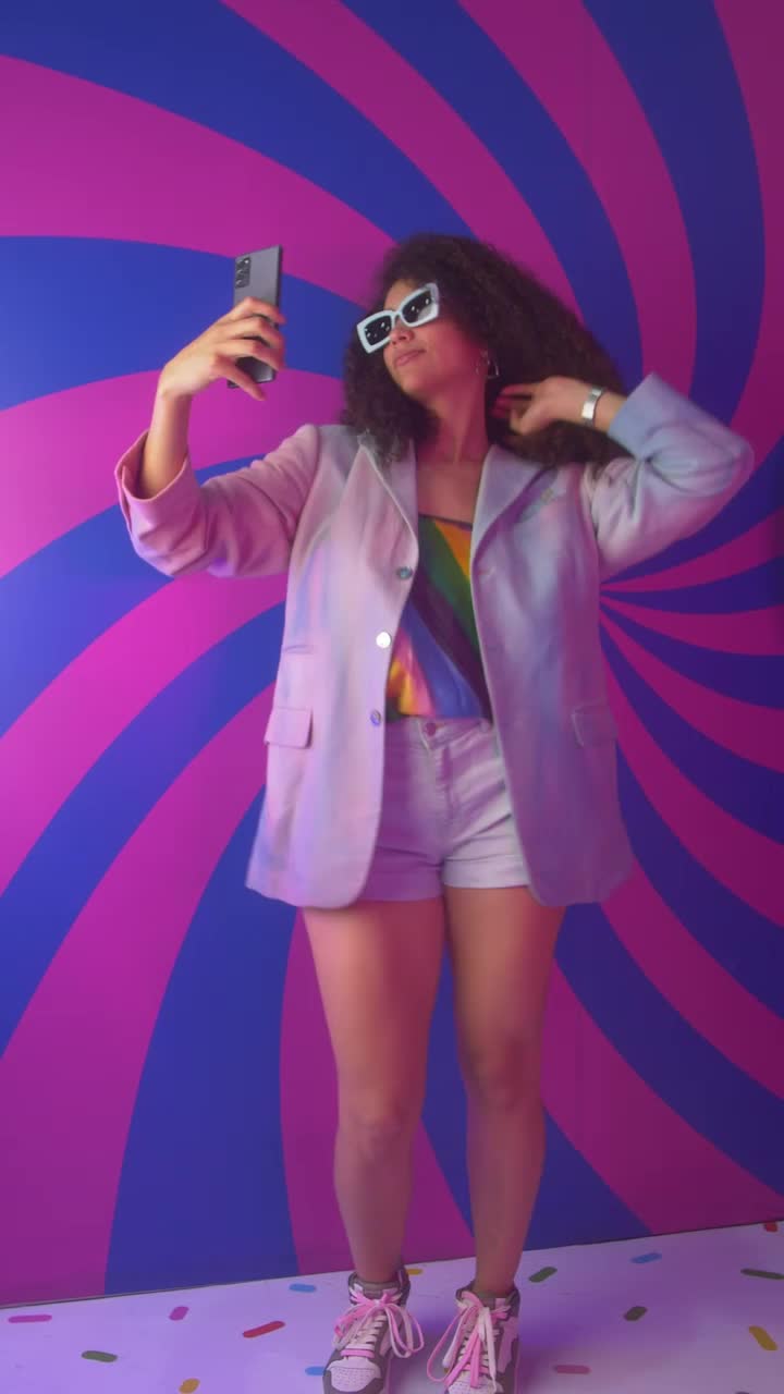 Stock Video Girl Recording Herself Dancing With A Colorful Background Live Wallpaper For PC