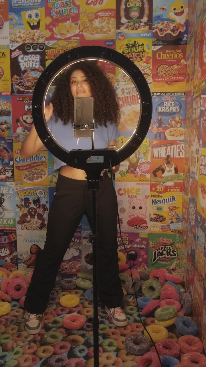 Stock Video Girl Recording A Video On A Background Of Cereal Boxes Live Wallpaper For PC