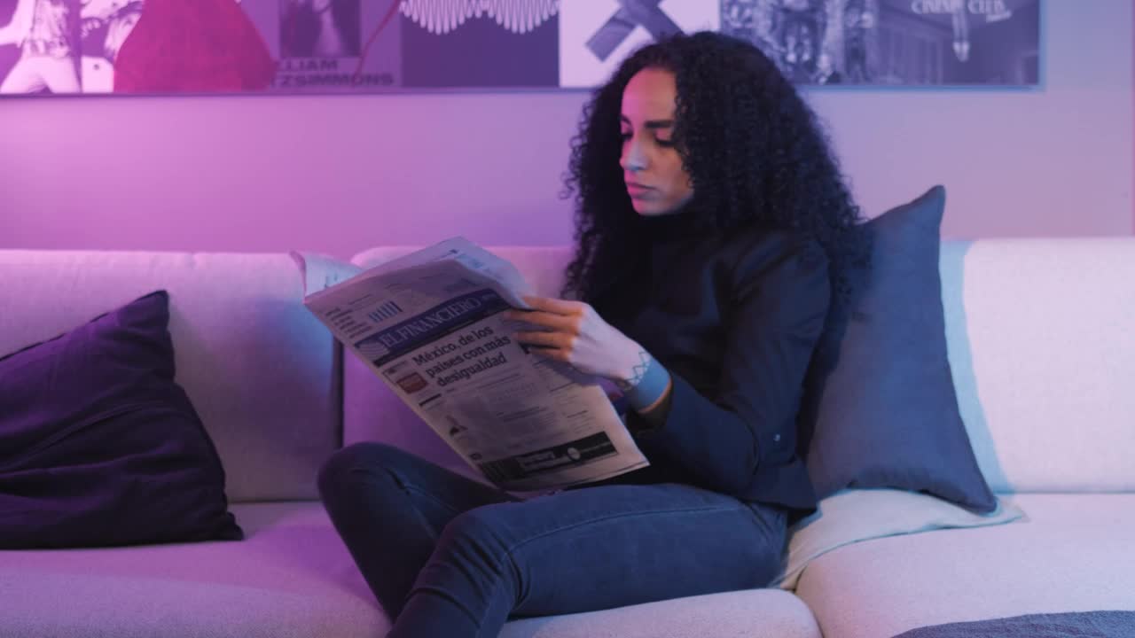 Stock Video Girl Reading The Pages Of A Newspaper Live Wallpaper For PC