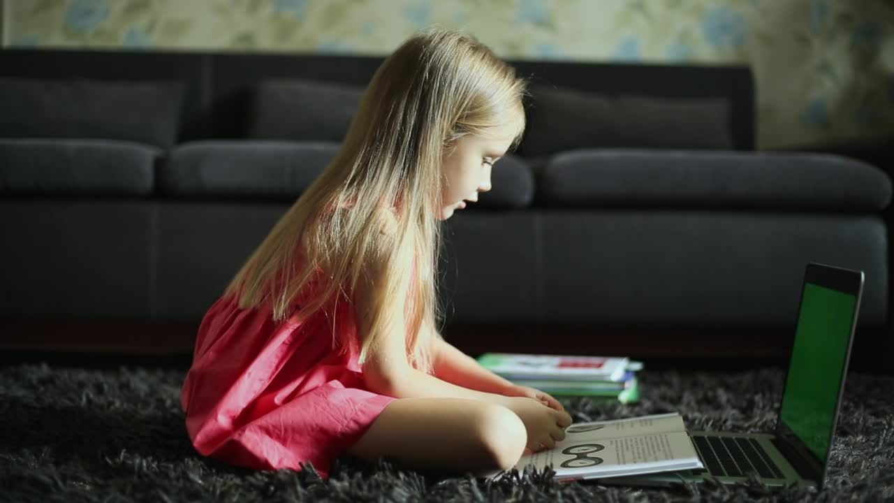 Stock Video Girl Reading In Front Of The Laptop At Home Live Wallpaper For PC