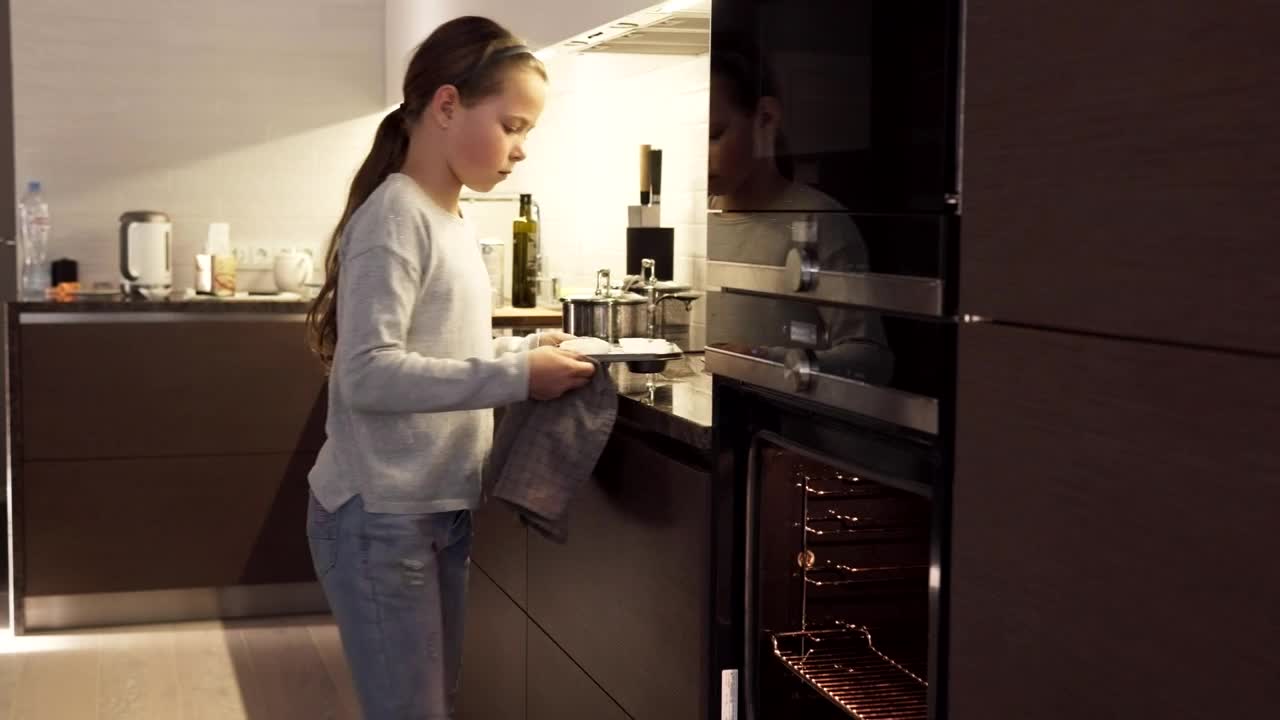 Stock Video Girl Putting Cookies In An Oven Live Wallpaper For PC