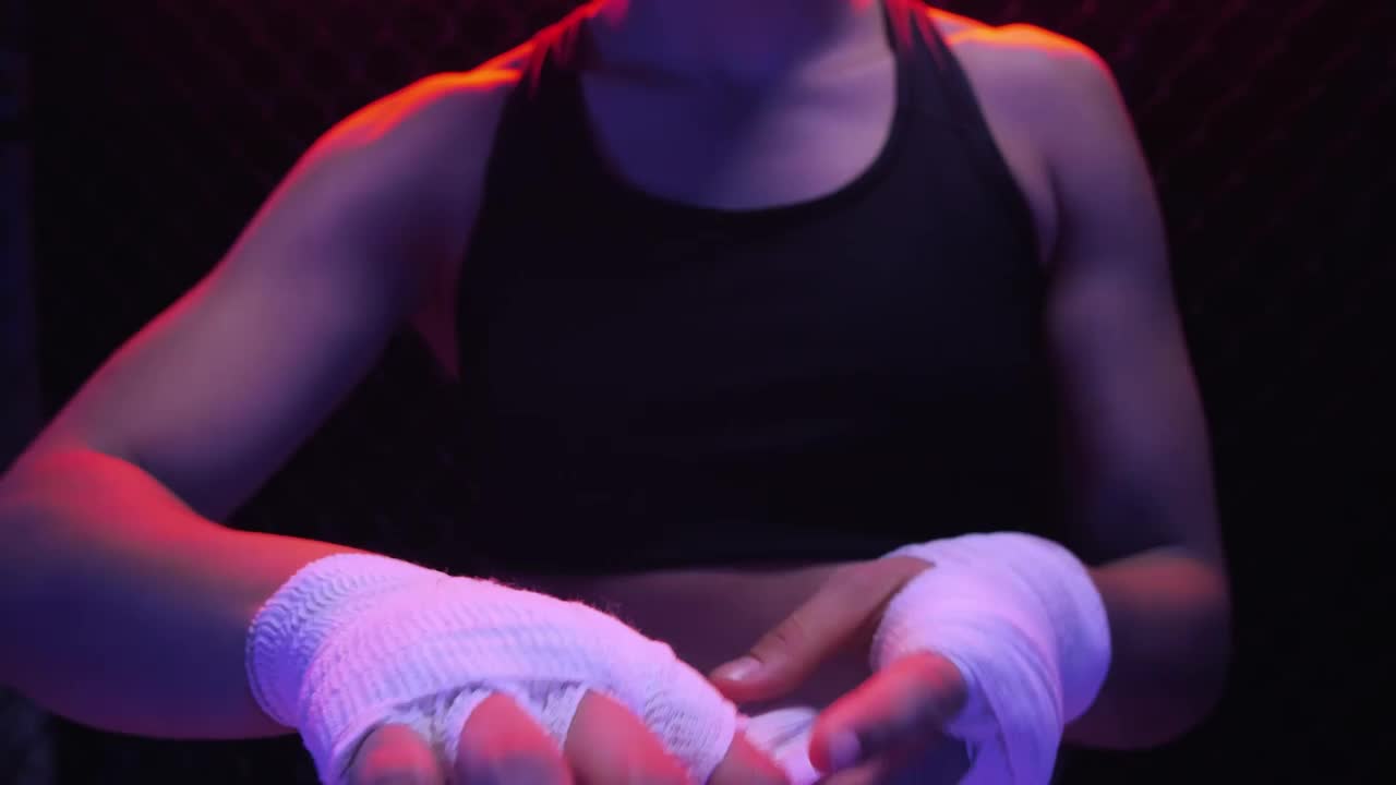 Stock Video Girl Putting A Bandage On Her Hands Before A Fight Live Wallpaper For PC