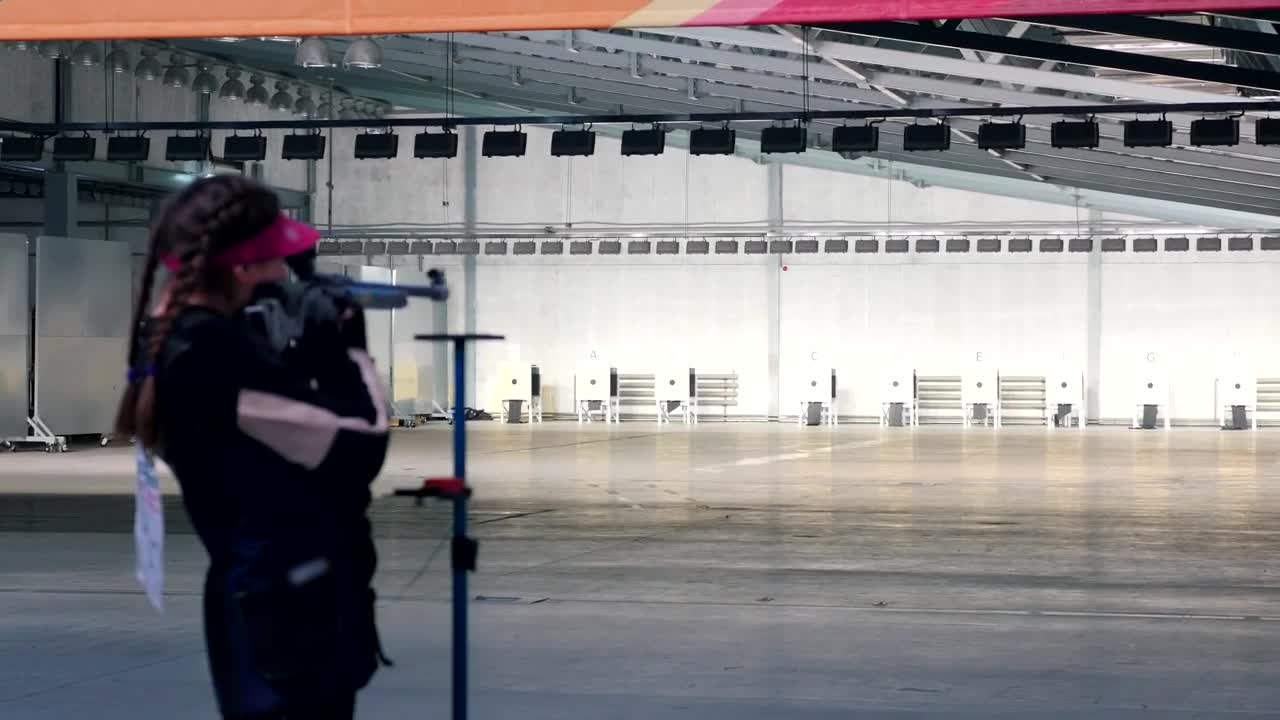 Stock Video Girl Practicing Target Shooting With A Gun Live Wallpaper For PC