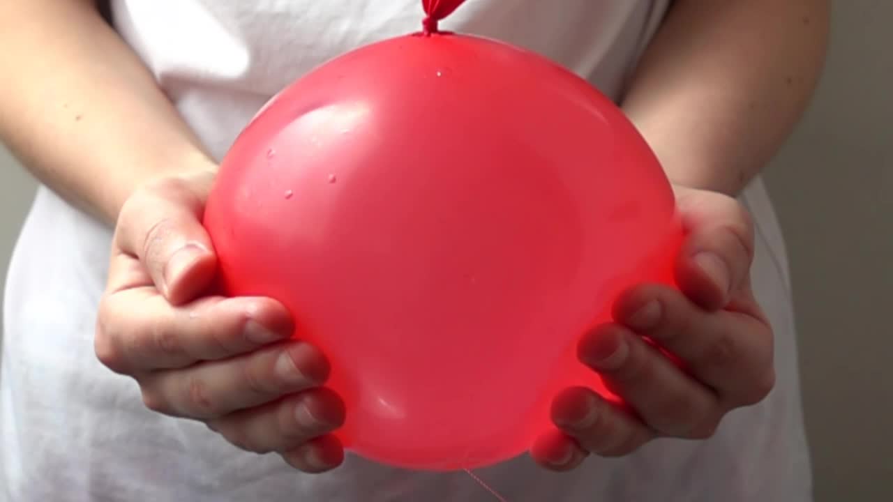 Stock Video Girl Popping A Water Balloon Live Wallpaper For PC