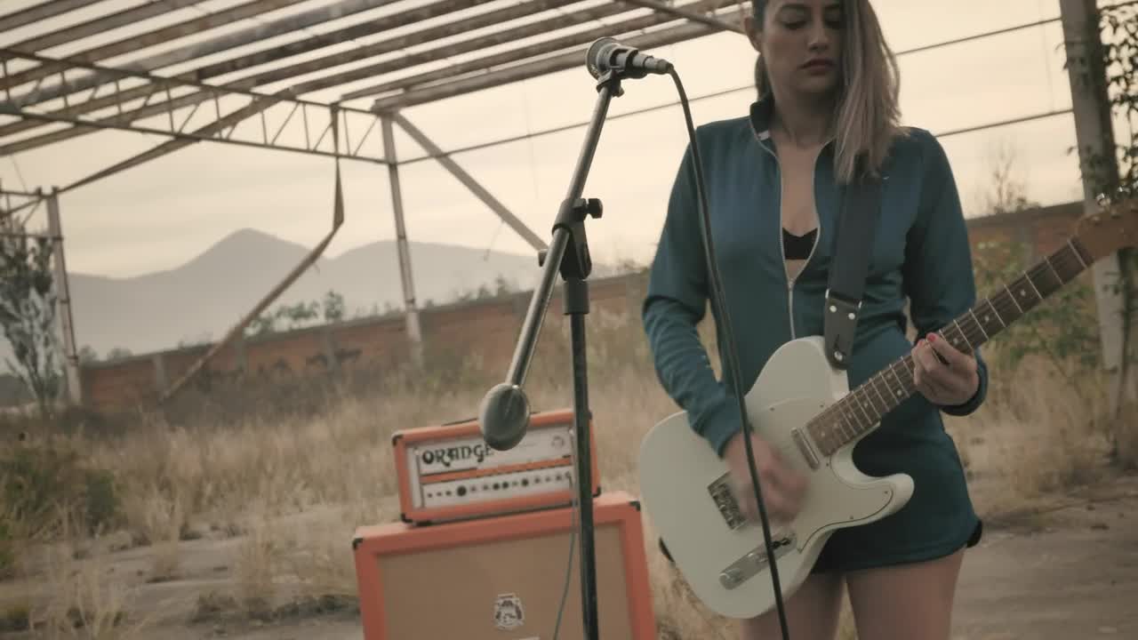 Stock Video Girl Playing Guitar In A Wasteland Live Wallpaper For PC