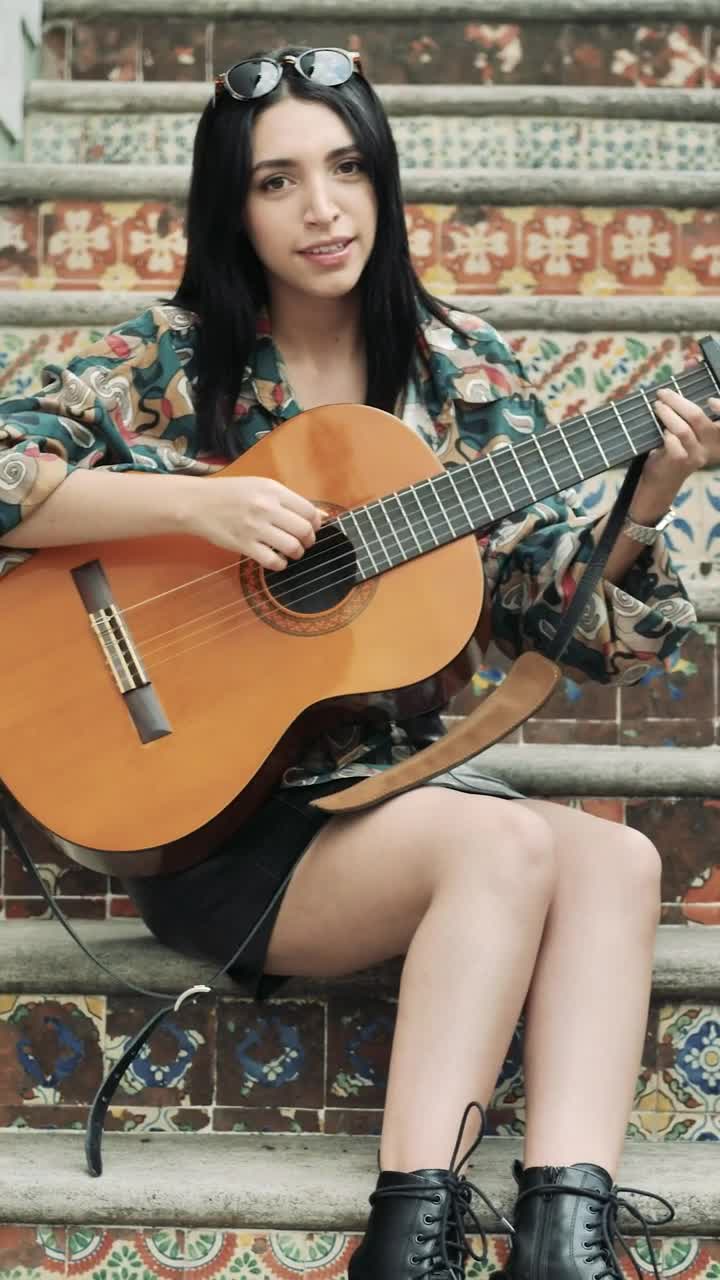 Stock Video Girl On A Ladder Plays The Guitar And Smiles Straight Live Wallpaper For PC