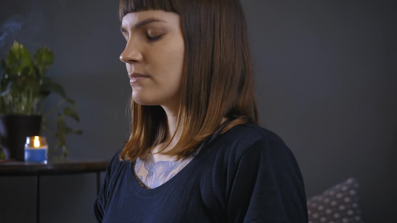 Stock Video Girl Meditating In Yoga Pose On The Floor Of Her Live Wallpaper For PC