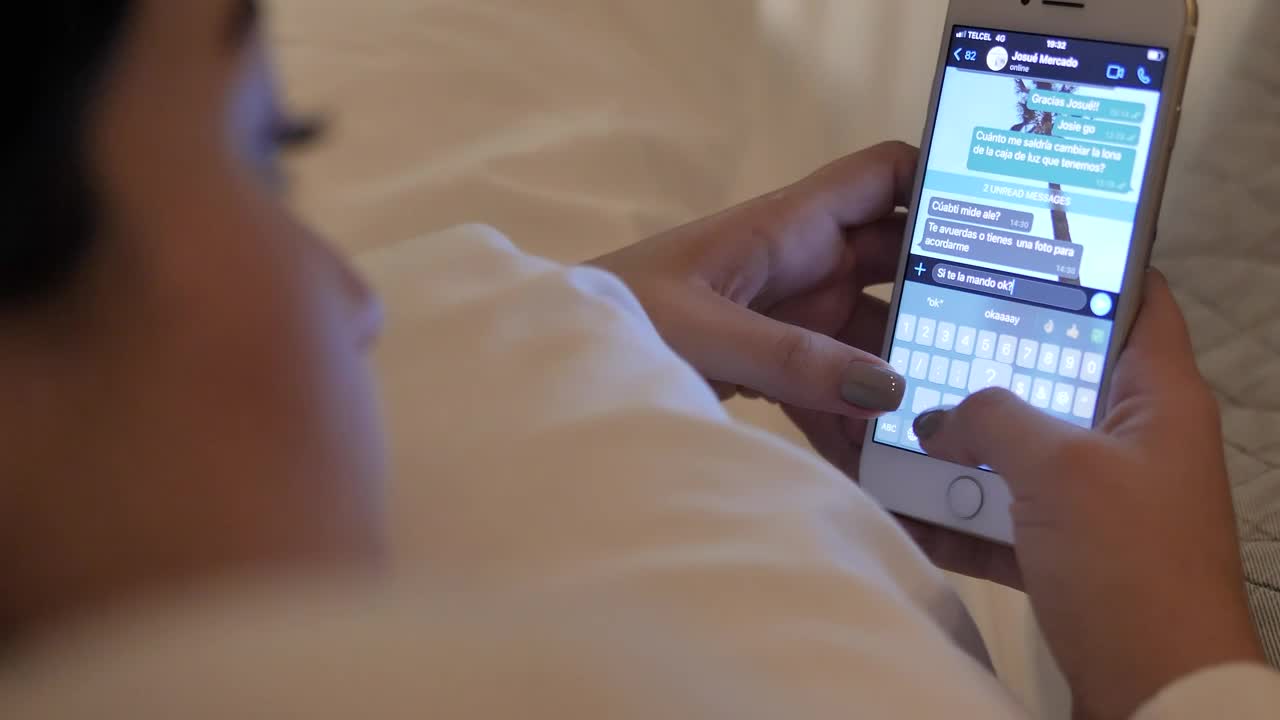 Stock Video Girl Lying On Her Bed Chatting On Cell Phone Live Wallpaper For PC