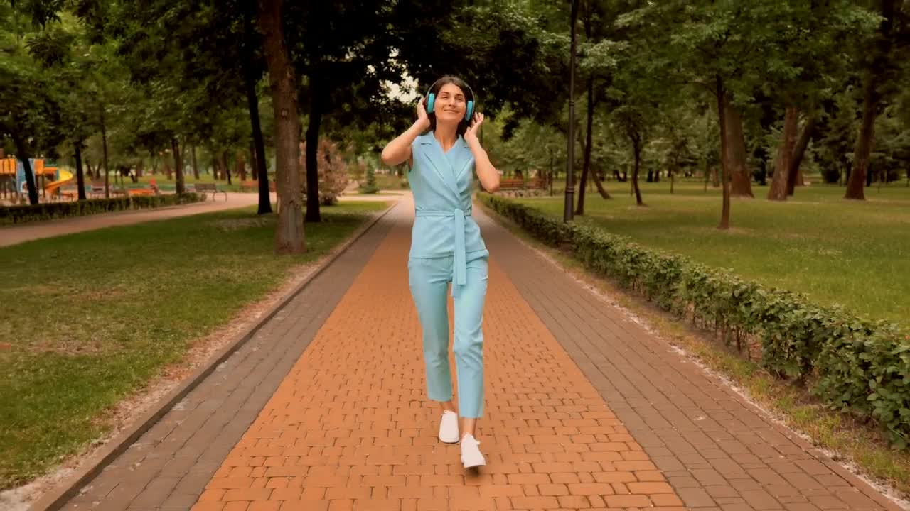 Stock Video Girl Listens To Music And Dances Happily Live Wallpaper For PC