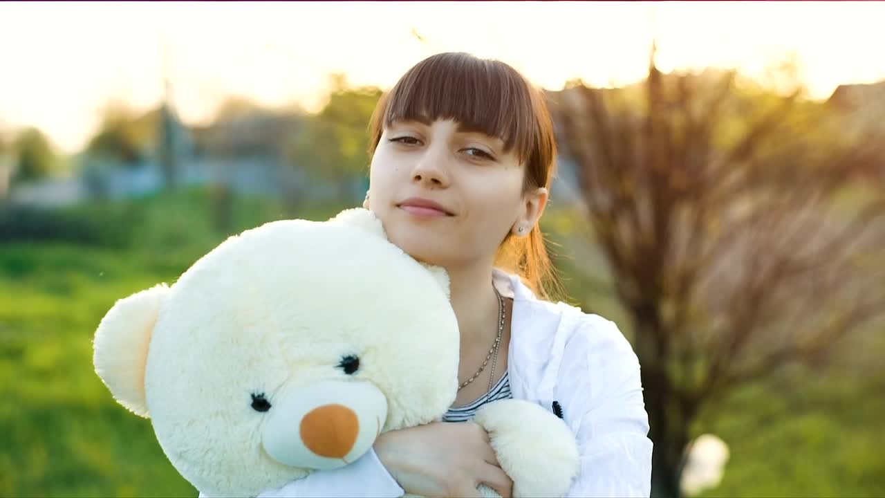 Stock Video Girl Hugging A Teddy Bear Outdoors Live Wallpaper For PC