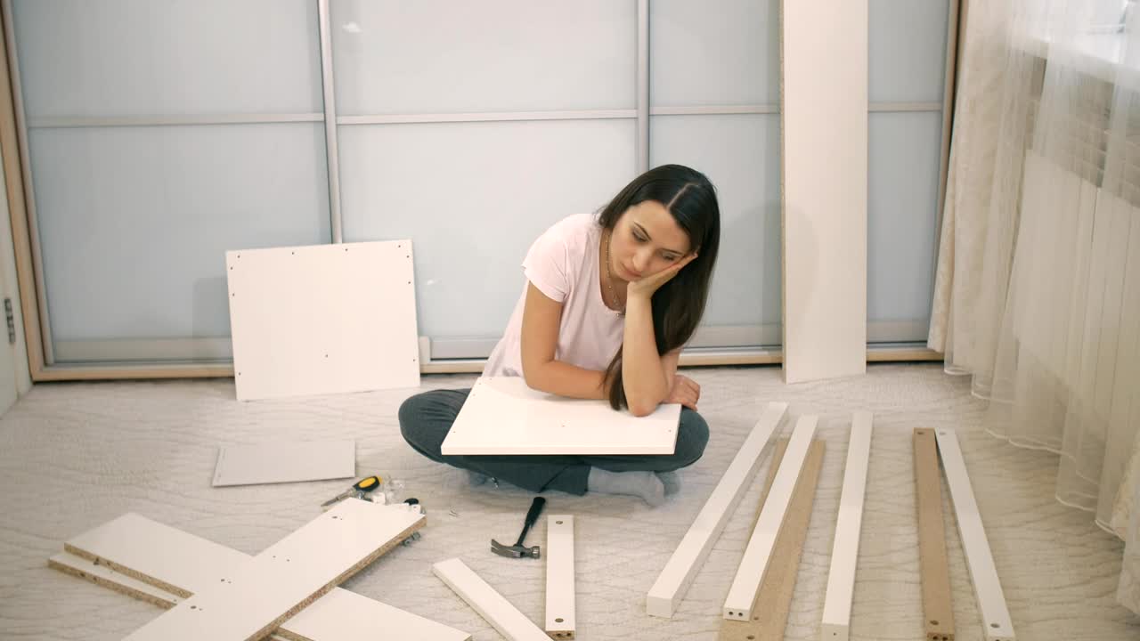 Stock Video Girl Frustrated When Assembling A Furniture Live Wallpaper For PC