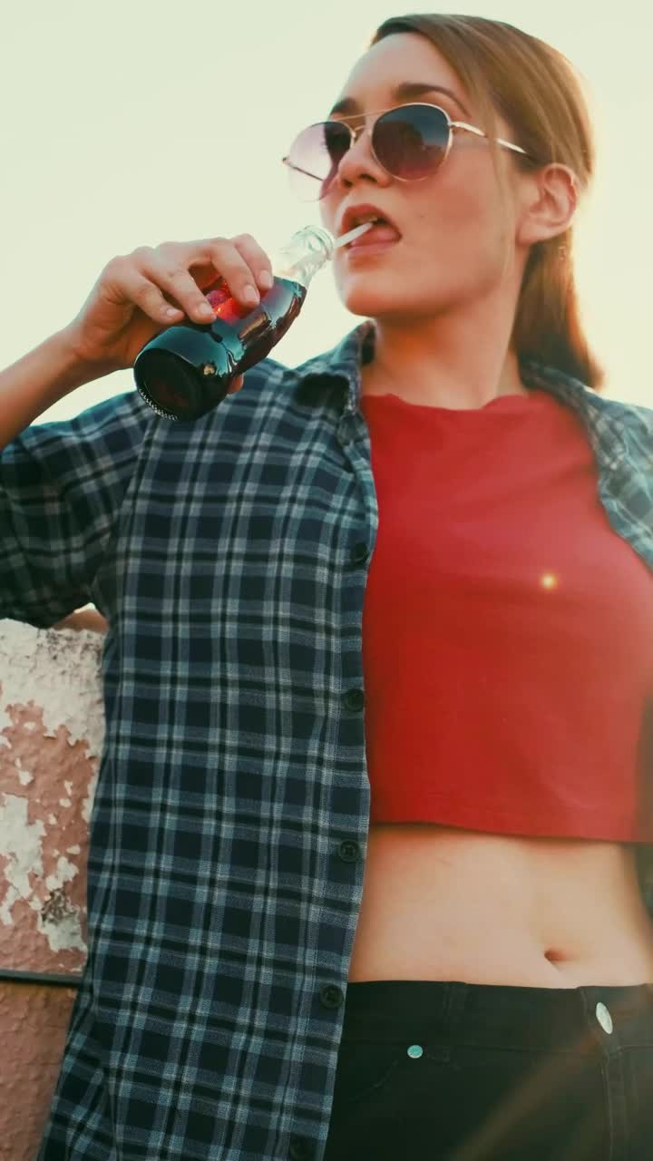 Stock Video Girl Drinking Soda From A Bottle With A Straw Live Wallpaper For PC