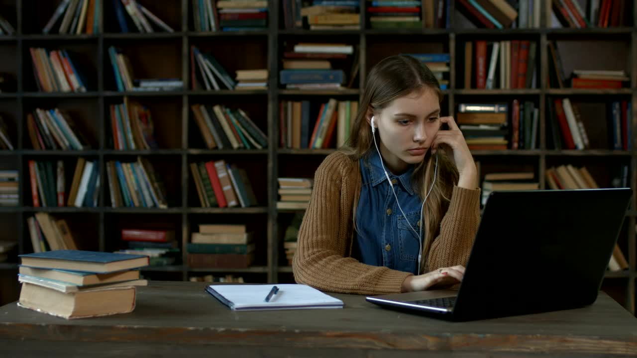 Stock Video Girl Doing Homework In A Library Live Wallpaper For PC