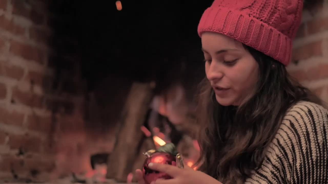 Stock Video Girl Decorating Christmas Tree Next To A Fireplace Live Wallpaper For PC