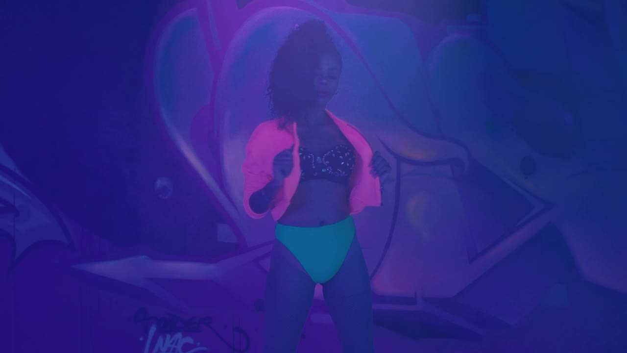 Stock Video Girl Dancing Under Black Light In Front Of A Wall Live Wallpaper For PC