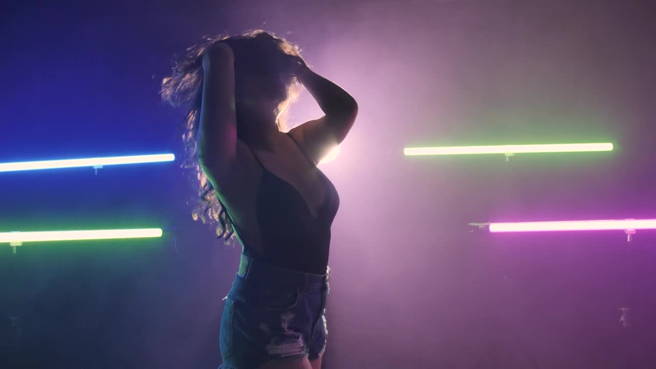 Stock Video Girl Dancing On A Dark Floor Under Colored Lights Live Wallpaper For PC