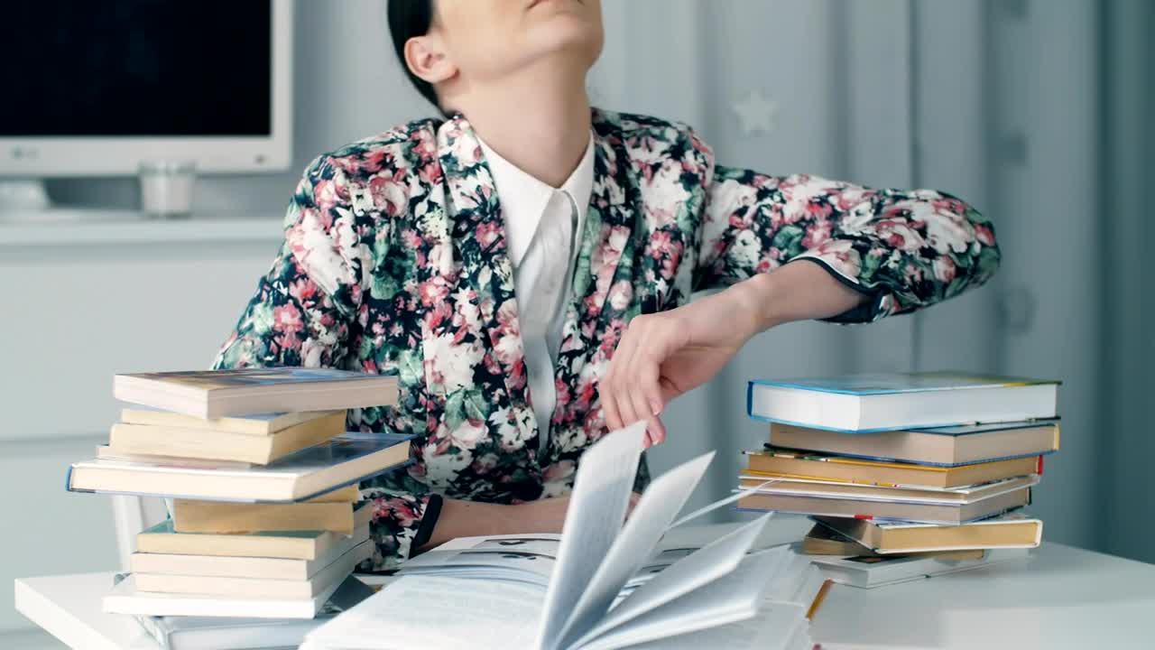 Stock Video Girl Bows Her Head Exhausted From Studying Live Wallpaper For PC