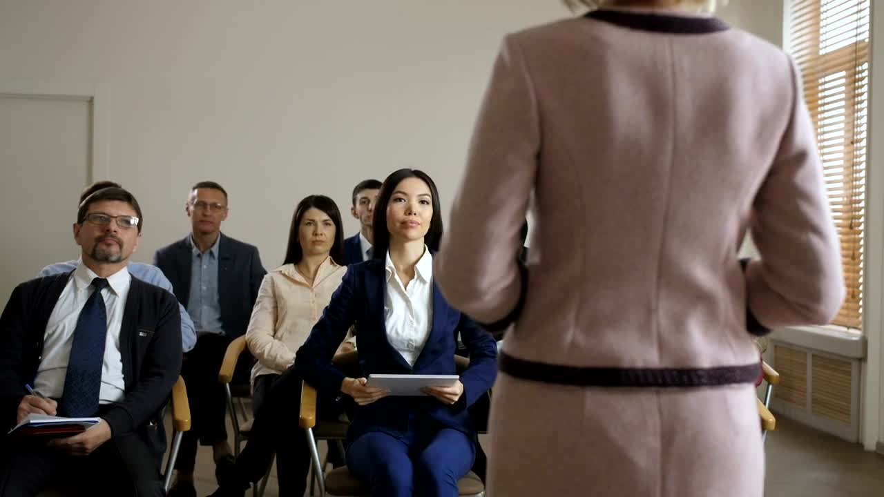 Stock Video Girl Asking In A Formal Meeting With More People Live Wallpaper For PC