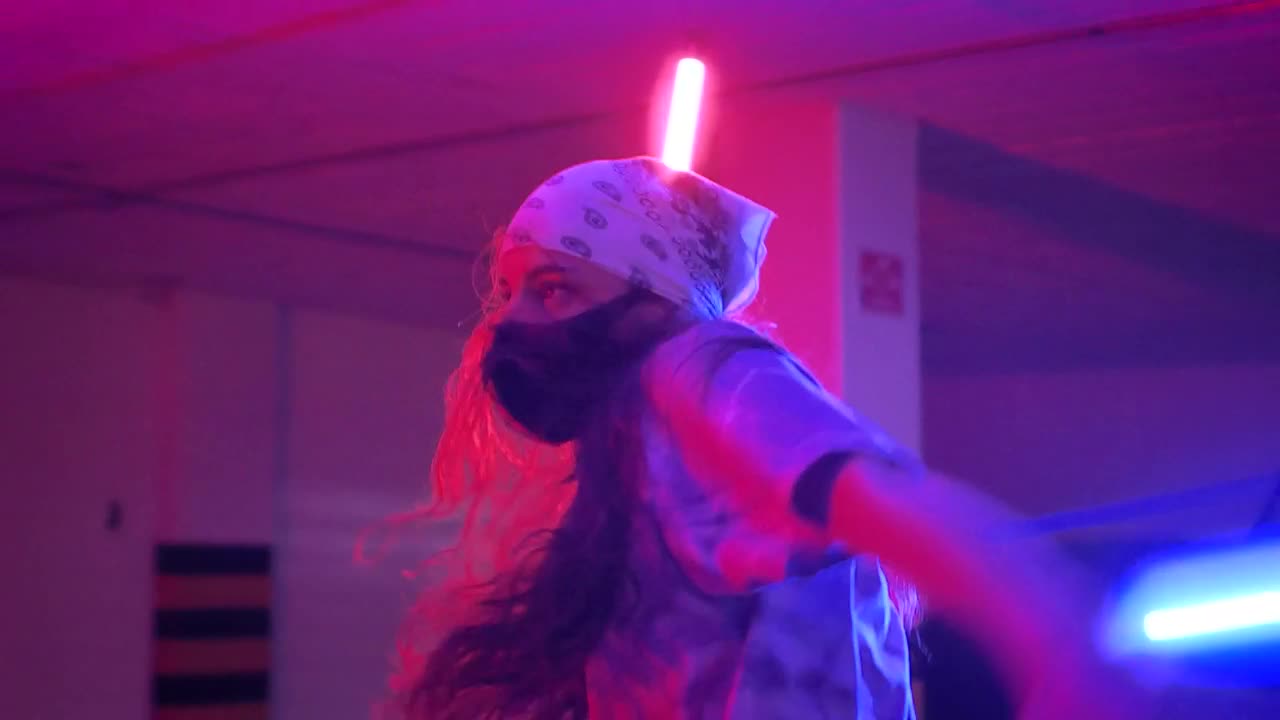 Stock Video Girl And Boy With Masks Dancing Under Colored Lights Live Wallpaper For PC