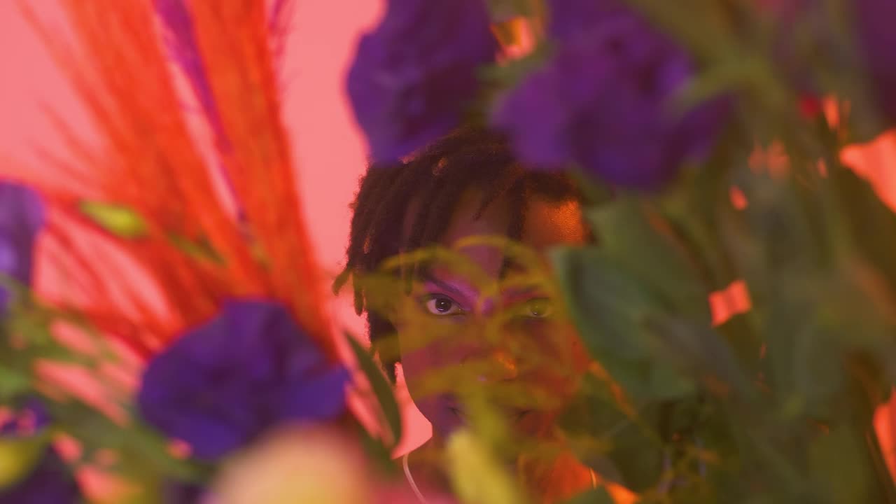 Stock Video Gay Boy Looking Straight Through Flowers Live Wallpaper For PC