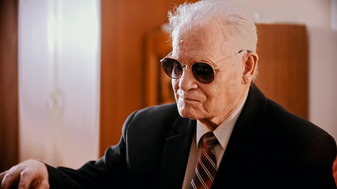 Stock Video Gangster With Sunglasses Preparing A Gun Live Wallpaper For PC