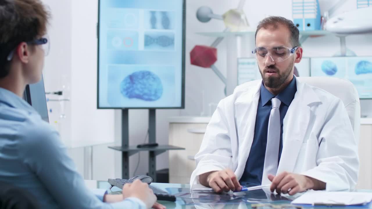 Stock Video Future Scientist Uses Ar Glasses In Meeting With Colleague Live Wallpaper For PC